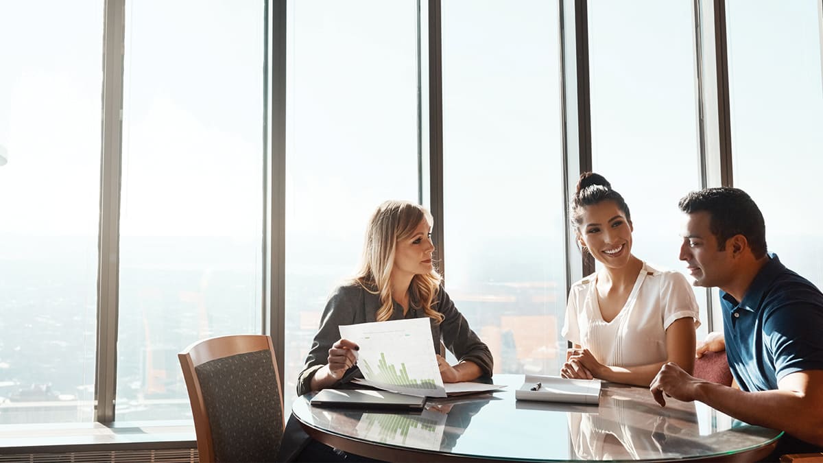 advisor-helping-couple-money-finance-office-robo-velox-clearing